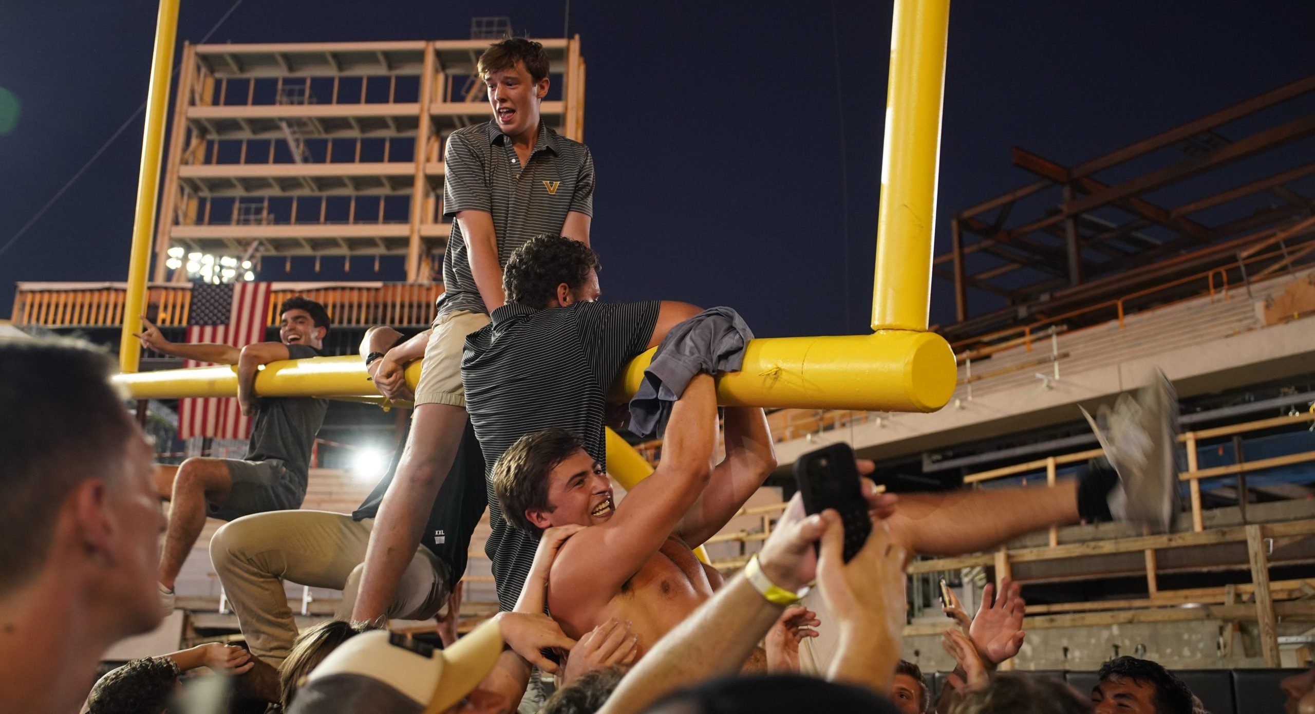 Vanderbilt fans hanging on the torn down goalpost after their upset win over Alabama in Week 6