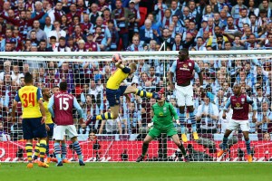 LONDON, ENGLAND - MAY 30:  Per Mertesacker (C) of Arsenal scores their third goal during the FA Cup Final between Aston Villa and Arsenal at Wembley Stadium on May 30, 2015 in London, England.  (Photo by Paul Gilham/Getty Images)