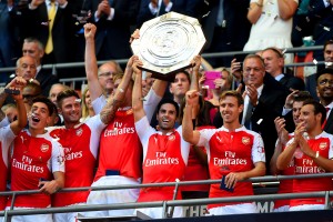 LONDON, ENGLAND - AUGUST 02:  Captain Mikel Arteta of Arsenal lifts the trophy after their 1-0 win in the FA Community Shield match between Chelsea and Arsenal at Wembley Stadium on August 2, 2015 in London, England.  (Photo by Mike Hewitt/Getty Images)