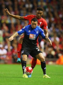 LIVERPOOL, ENGLAND - AUGUST 17:  Lee Tomlin of Bournemouth holds off Joe Gomez of Liverpool during the Barclays Premier League match between Liverpool and A.F.C. Bournemouth at Anfield on August 17, 2015 in Liverpool, United Kingdom.  (Photo by Alex Livesey/Getty Images)