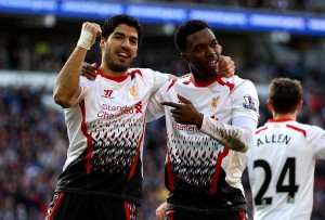CARDIFF, WALES - MARCH 22:  Daniel Sturridge of Liverpool celebrates with team mate Luis Suarez after scoring his team's fifth goal during the Barclays Premier League match between Cardiff City and Liverpool at Cardiff City Stadium on March 22, 2014 in Cardiff, Wales.  (Photo by Ben Hoskins/Getty Images)