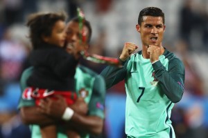 LENS, FRANCE - JUNE 25:  Cristiano Ronaldo of Portugal celebrates his team's 1-0 win after the UEFA EURO 2016 round of 16 match between Croatia and Portugal at Stade Bollaert-Delelis on June 25, 2016 in Lens, France.  (Photo by Clive Mason/Getty Images)