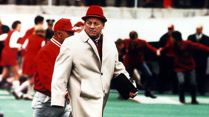 Before Tom Osborne reigned in Lincoln, Bob Devaney established Nebraska as a national powerhouse. Osborne is the name most closely associated with Nebraska football, especially as his successors have failed to maintain what he developed. Yet, all that Osborne developed flowed from what Devaney originally built. (Photo courtesy of the Nebraska sports magazine Hail Varsity)