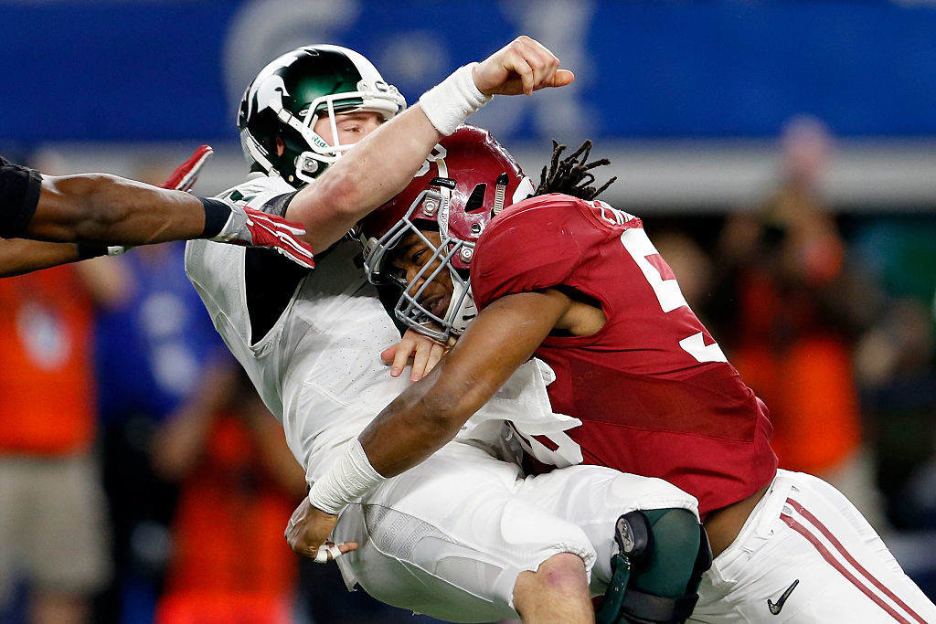 ARLINGTON, TX - DECEMBER 31: Tim Williams #56 of the Alabama Crimson Tide sacks Connor Cook #18 of the Michigan State Spartans in the second half during the Goodyear Cotton Bowl at AT&T Stadium on December 31, 2015 in Arlington, Texas. (Photo by Ron Jenkins/Getty Images)