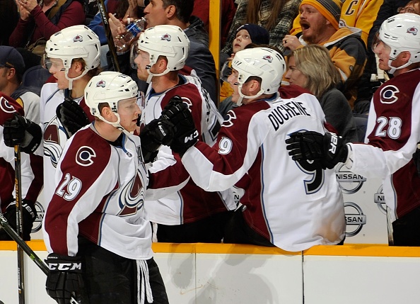 NASHVILLE, TN - DECEMBER 06:  Matt Duchene #9 and Patrick Wiercioch #28 of the Colorado Avalanche congratulate teammate Nathan MacKinnon #29 on scoring a goal against the Nashville Predators during the first period at Bridgestone Arena on December 6, 2016 in Nashville, Tennessee.  (Photo by Frederick Breedon/Getty Images)