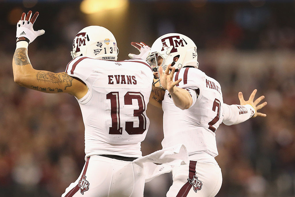 ARLINGTON, TX - JANUARY 04:  Johnny Manziel #2 of the Texas A&M Aggies celebrates his touchdown with Mike Evans #13 against the Oklahoma Sooners during the Cotton Bow lat Cowboys Stadium on January 4, 2013 in Arlington, Texas.  (Photo by Ronald Martinez/Getty Images)
