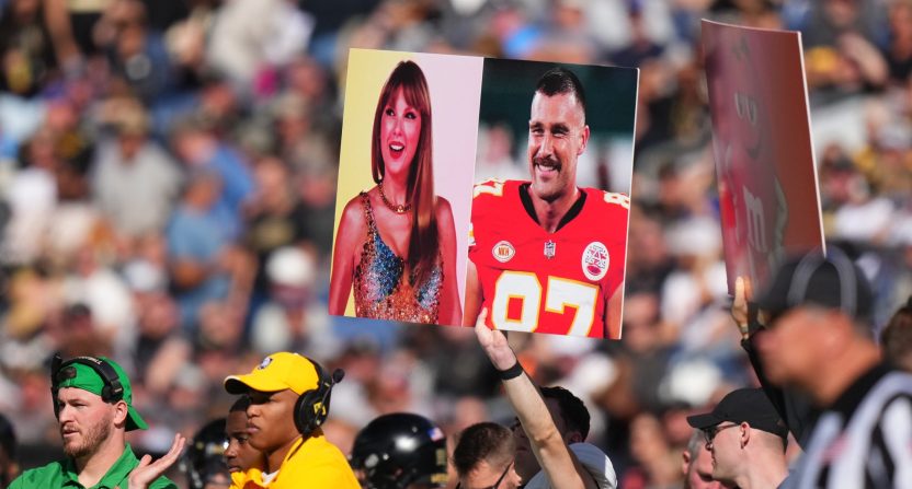 Army Black Knights members hold up a call in play sign of American recording artist Taylor Swift and American football player Travis Kelce.