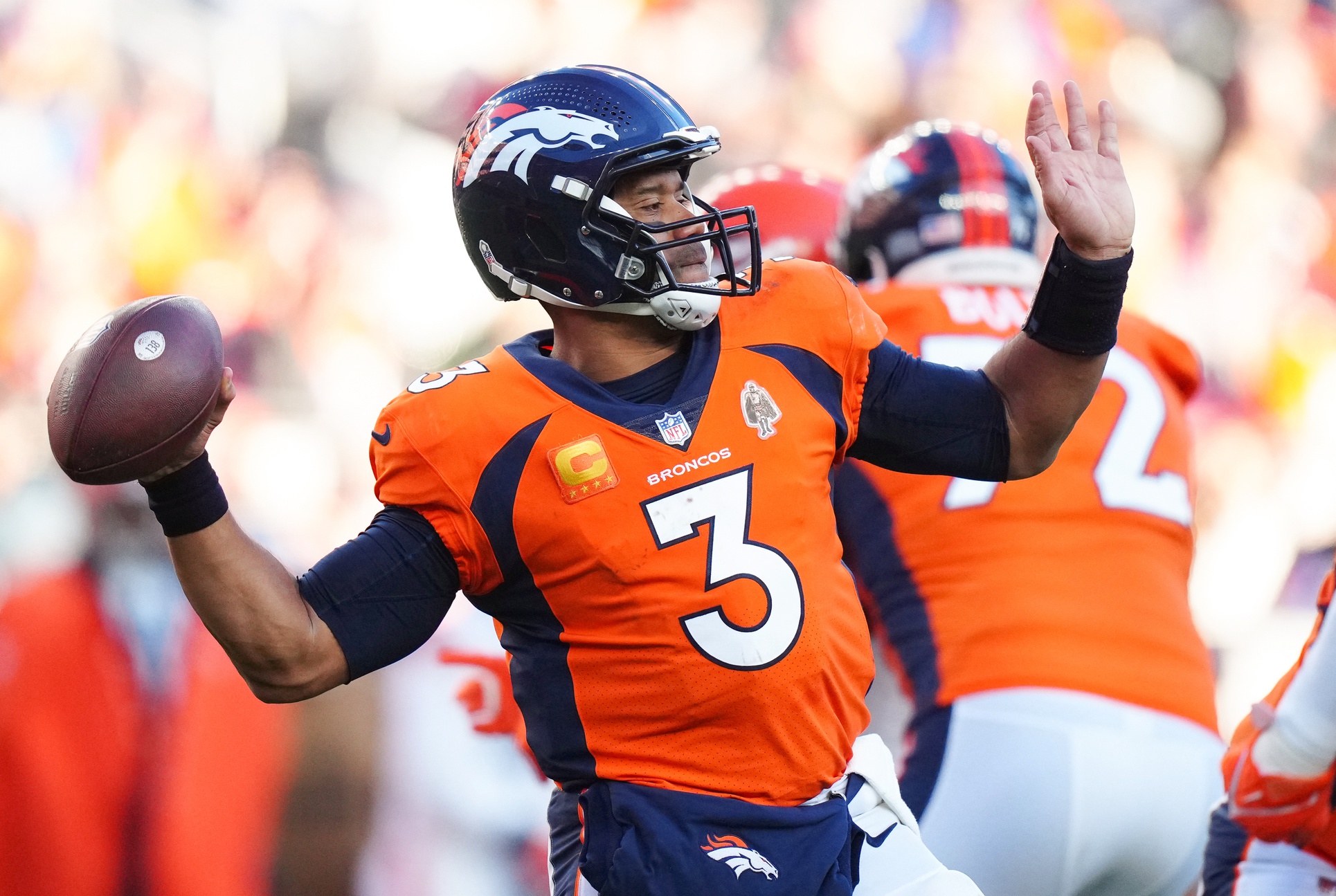 Nov 26, 2023; Denver, Colorado, USA; Denver Broncos quarterback Russell Wilson (3) throws the ball in the second quarter against the Cleveland Browns at Empower Field at Mile High. Mandatory Credit: Ron Chenoy-USA TODAY Sports