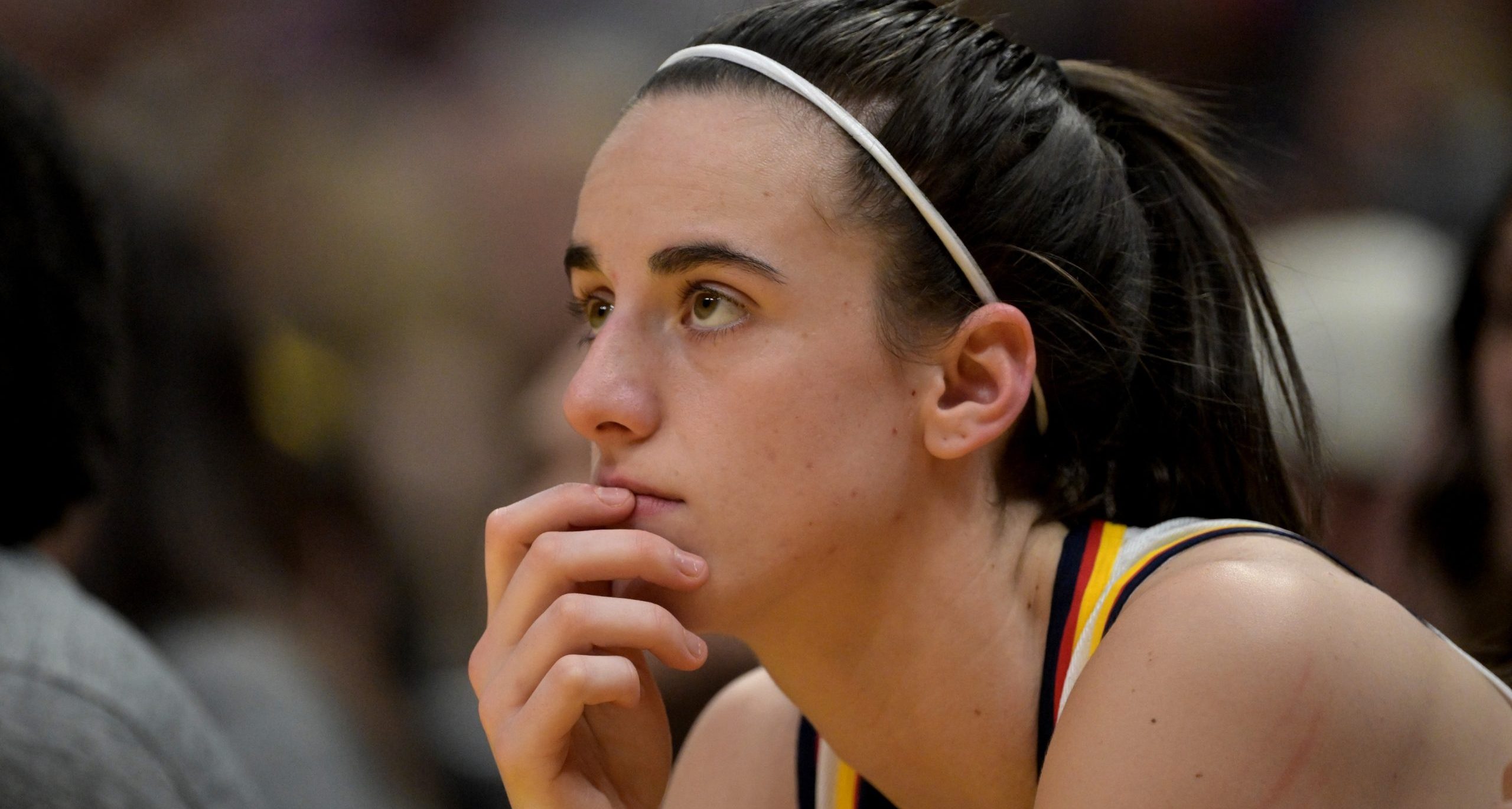 May 24, 2024; Los Angeles, California, USA; Indiana Fever guard Caitlin Clark (22) loos on from the bench in the first half against the Los Angeles Sparks at Crypto.com Arena. Mandatory Credit: Jayne Kamin-Oncea-USA TODAY Sports