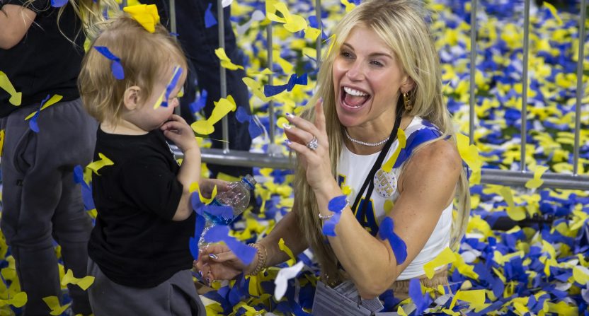 Feb 13, 2022; Inglewood, CA, USA; Kelly Stafford, wife of Los Angeles Rams quarterback Matthew Stafford (not pictured) plays with their daughters in the confetti as they celebrate after defeating the Cincinnati Bengals during Super Bowl LVI at SoFi Stadium. Mandatory Credit: Mark J. Rebilas-USA TODAY Sports