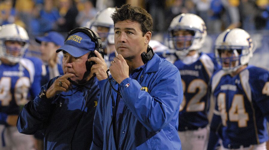 A screenshot from the NBC series 'Friday Night Lights' of Kyle Chandler playing coach Eric Taylor.