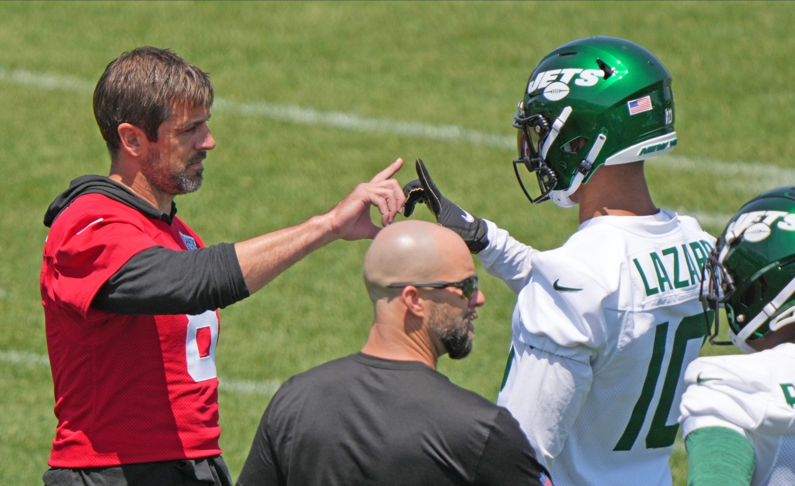 Aaron Rodgers and Allen Lazard on the New York Jets' practice field.