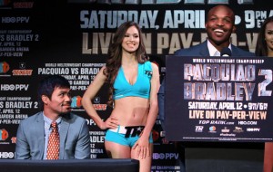 Timothy Bradley, standing at right, Manny Pacquiao, sitting