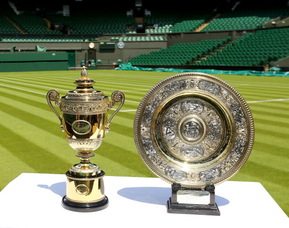 LONDON, ENGLAND - JUNE 21:  The Gentlemen's (left) and Ladies' (right) singles trophies are seen on Centre Court during previews at Wimbledon on June 21, 2014 in London, England.  (Photo by Al Bello/Getty Images)