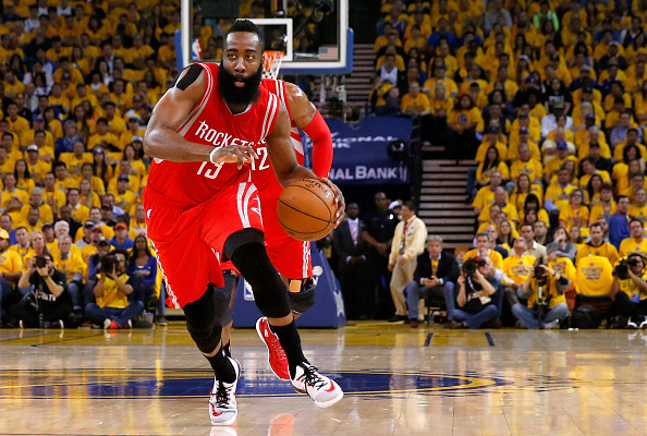 OAKLAND, CA - MAY 27:  James Harden #13 of the Houston Rockets drives to the basket in the first half against the Golden State Warriors during game five of the Western Conference Finals of the 2015 NBA Playoffs at ORACLE Arena on May 27, 2015 in Oakland, California. NOTE TO USER: User expressly acknowledges and agrees that, by downloading and or using this photograph, user is consenting to the terms and conditions of Getty Images License Agreement.  (Photo by Ezra Shaw/Getty Images)