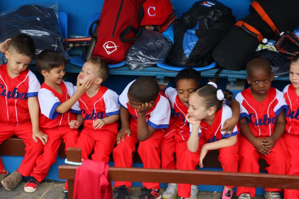 Gameday, Estadio Latino Americano…. Faces of the Cuban youngsters, in the Cuba dugout, minutes from participating in the pre-game ceremonies. (Photo Courtesy Bob Ley)