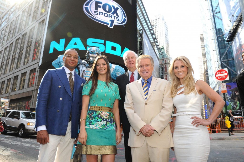 NEW YORK, NY - AUGUST 16:  Gus Johnson, Cleatus the Robot, Georgie Thompson, Bill Raftery, Regis Philbin and Katie Nolan ring the opening bell at the NASDAQ MarketSite on August 16, 2013 in New York City.  (Photo by Craig Barritt/Getty Images)