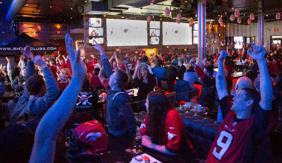 Canadian bars, like this one showing the 2014 Grey Cup, may have a tougher time airing sports in future.