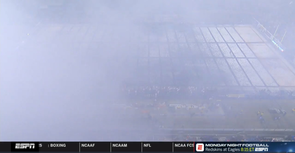 The Boise State field screened by smoke.