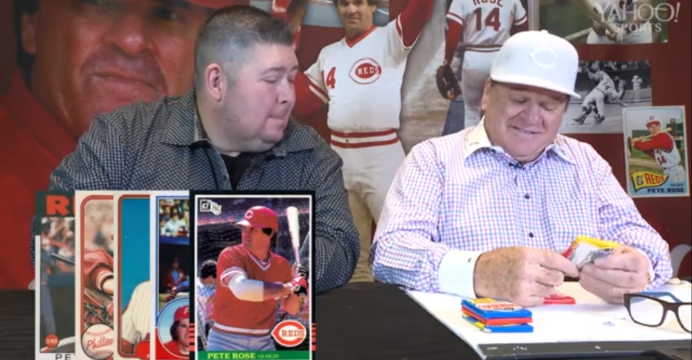 Yahoo's Mike Oz opening old baseball cards with Pete Rose.