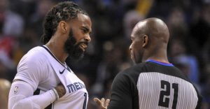 Mike Conley Jr. talks to referee David Guthrie during a March 27, 2019 game.