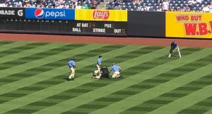 Bryan Hoch's photo of a fan on the field at Yankee Stadium.