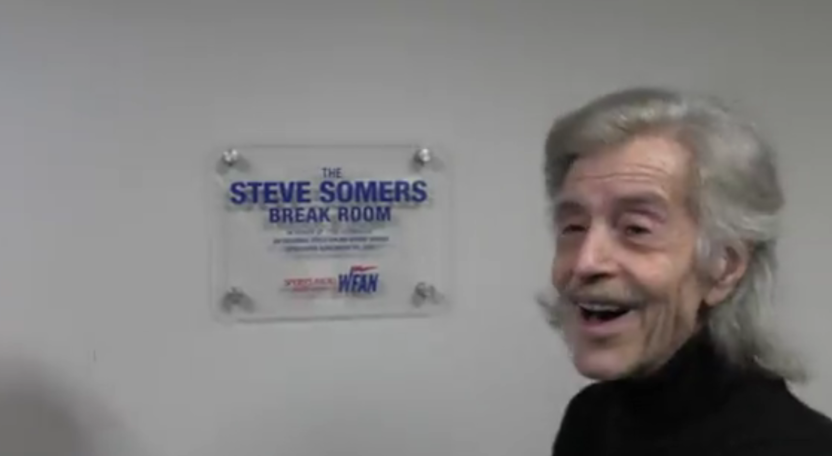 Steve Somers with a plaque honoring him in the break room.