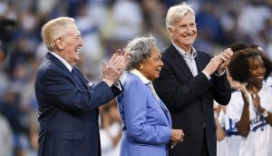 Legendary announcer Vin Scully (left) passed away on Tuesday at the age of 94
