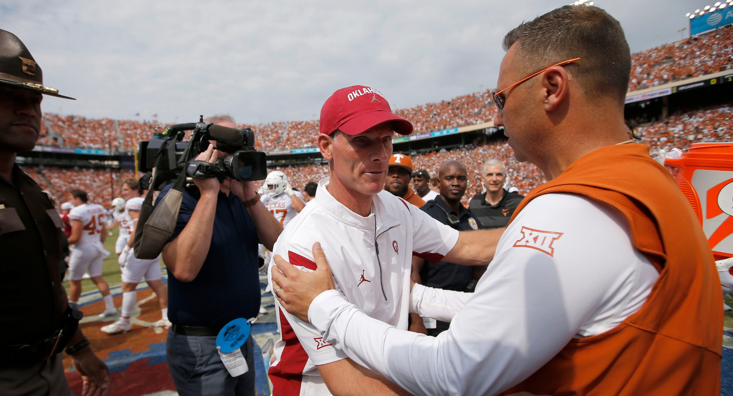 Oklahoma coach Brent Venables (L) and Texas coach Steve Sarkisian after the 2022 Red River Showdown.