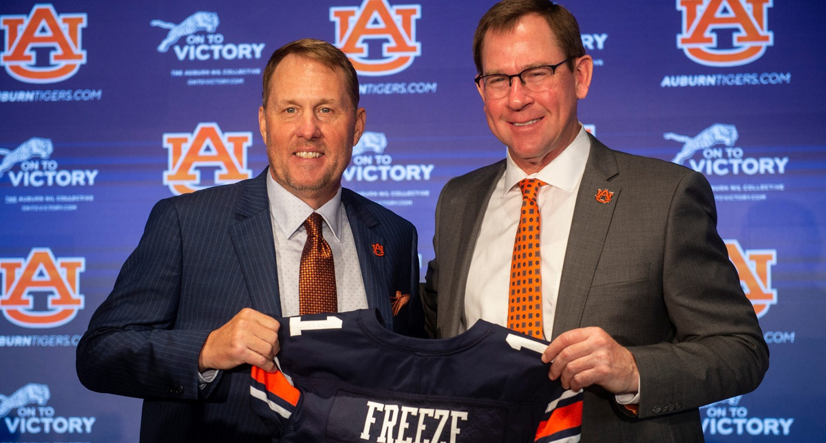 Hugh Freeze (L) with John Cohen at an Auburn press conference.