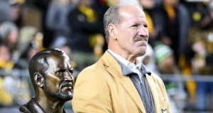 Bill Cowher with his Pro Football Hall of Fame bust in October 2021.