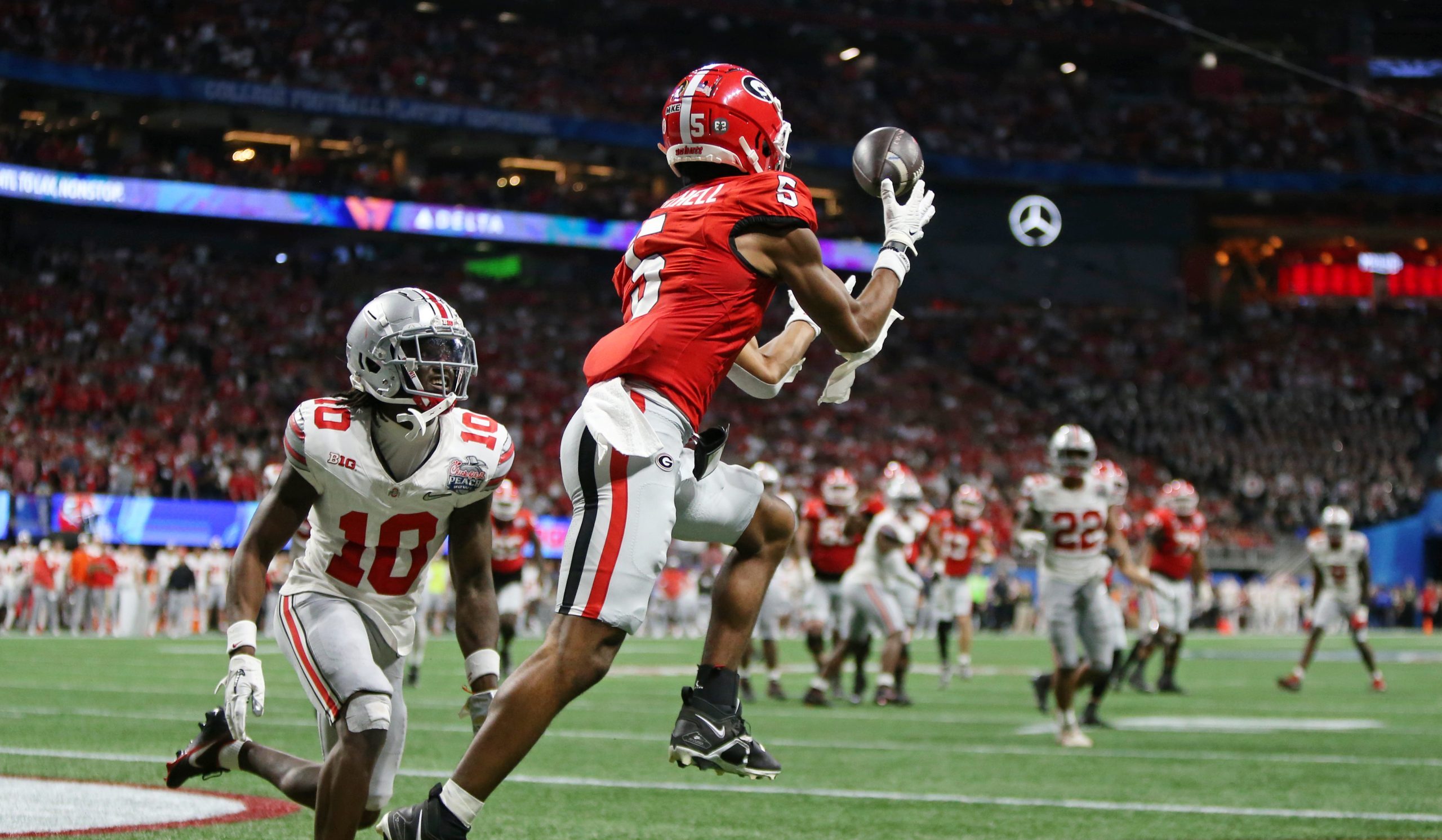 Adonai Mitchell catches a last-minute touchdown in the Georgia Bulldogs' College Football Playoff win over the Ohio State Buckeyes.
