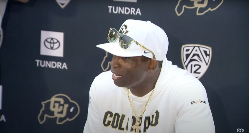 Deion Sanders talking to reporters after Colorado's upset win over TCU