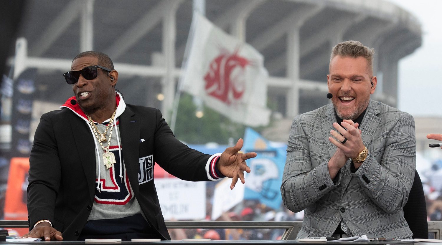 Pat McAfee reacts to Jackson State head coach Deion Sanders, left, while live on ESPN College GameDay before the Jackson State University vs. Southern game at Jackson Miss., Saturday, Oct. 29, 2022.