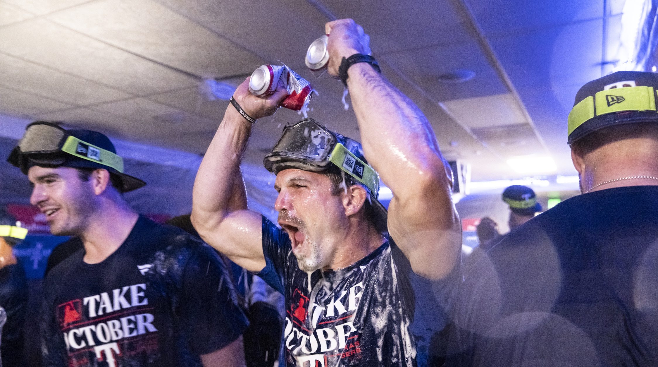 Texas Rangers celebrate in the clubhouse after clinching a post-season berth against the Seattle Mariners at T-Mobile Park