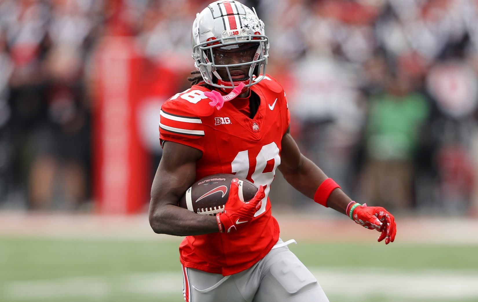 Oct 21, 2023; Columbus, Ohio, USA; Ohio State Buckeyes wide receiver Marvin Harrison Jr. (18) runs after a catch against the Penn State Nittany Lions during the second quarter at Ohio Stadium. Mandatory Credit: Joseph Maiorana-USA TODAY Sports