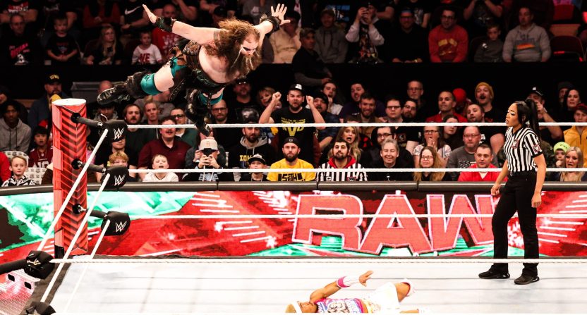 Ivar leaps off the top rope on top of Akira Tozawa during "WWE Monday Night Raw" at Wells Fargo Arena in Des Moines.
