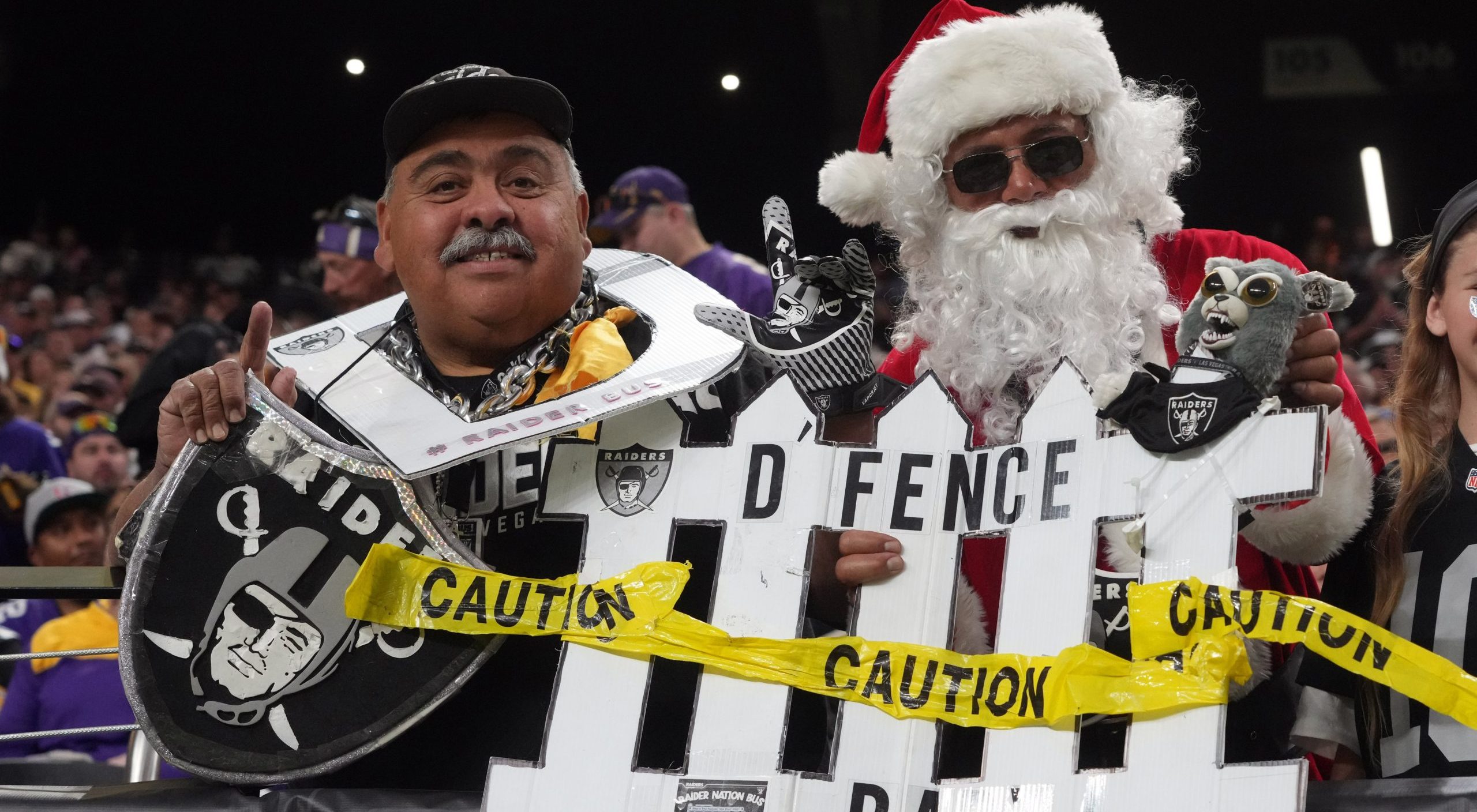 Dec 10, 2023; Paradise, Nevada, USA; Las Vegas Raiders fan Andy Coronado (left) poses with Santa Claus during the game against the Minnesota Vikings at Allegiant Stadium. Mandatory Credit: Kirby Lee-USA TODAY Sports