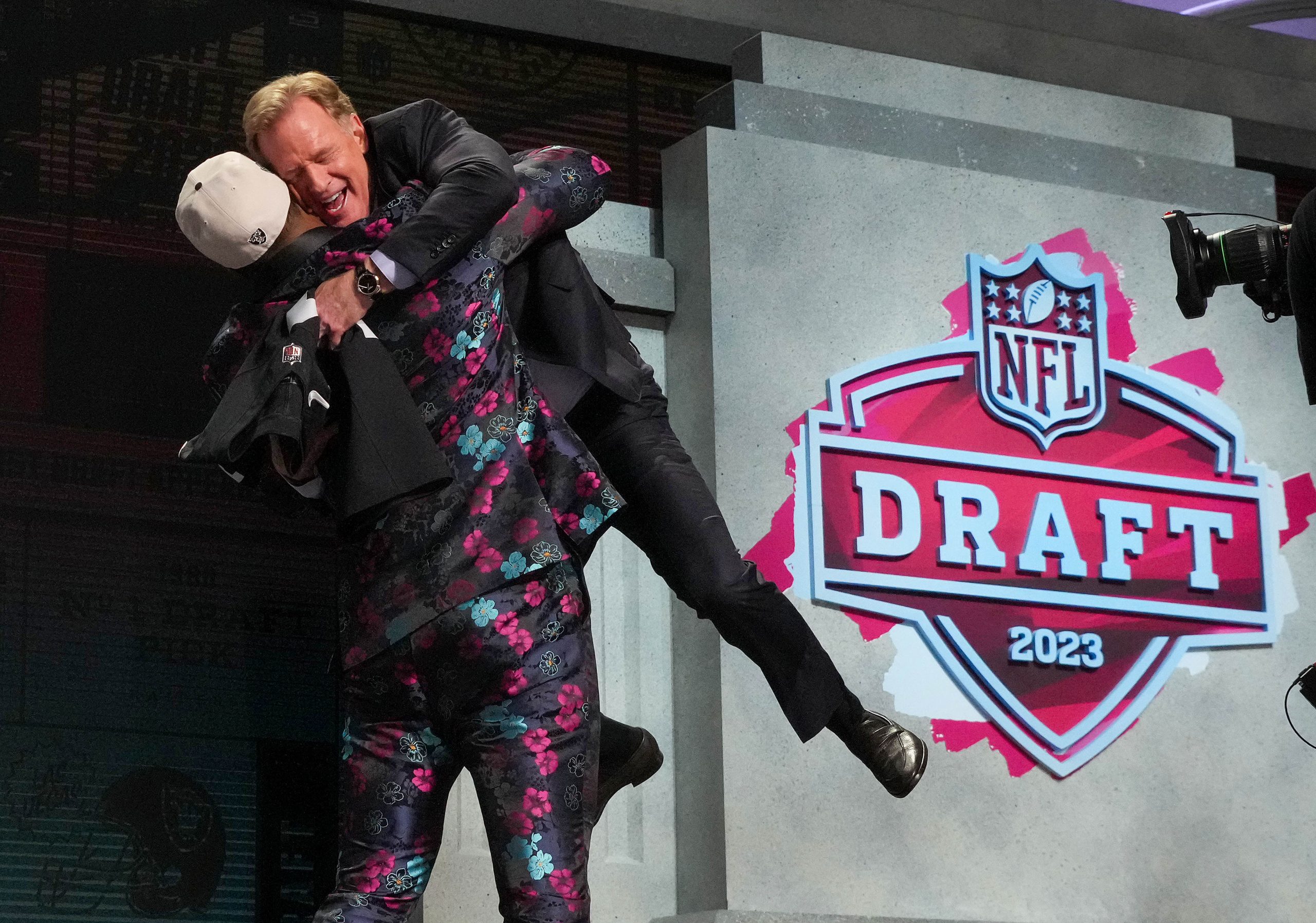 Apr 27, 2023; Kansas City, MO, USA; Texas Tech defensive end Tyree Wilson hugs NFL commissioner Roger Goodell after being selected by the Las Vegas Raiders seventh overall in the first round of the 2023 NFL Draft at Union Station.