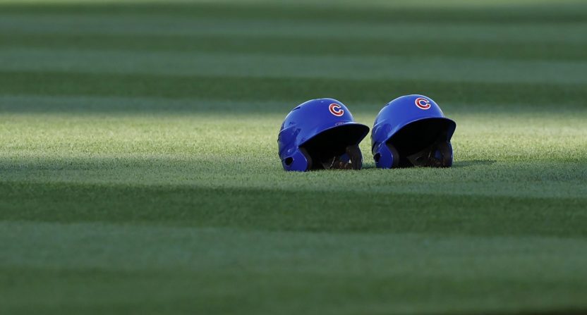 Apr 24, 2024; Chicago, Illinois, USA; Chicago Cubs helmets sit on the field before a baseball game between the Chicago Cubs and Houston Astros at Wrigley Field.
