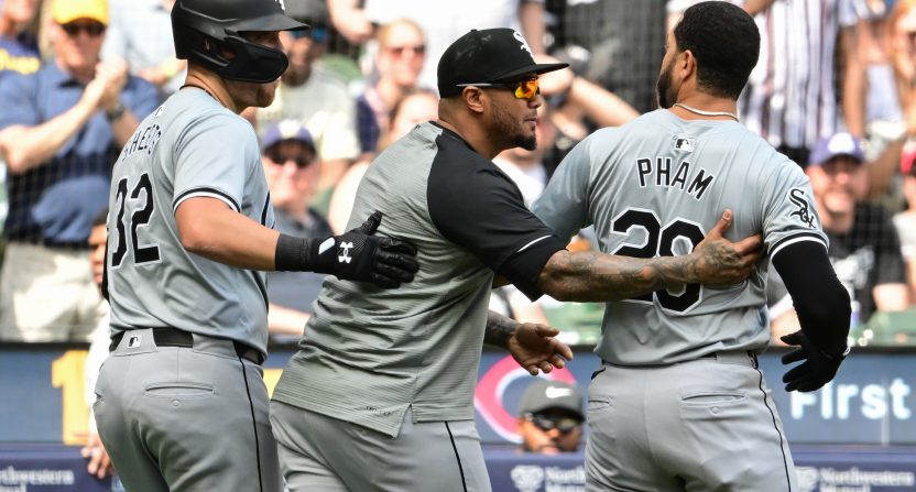 Tommy Pham is held back by coaches during Sunday's White Sox vs. Brewers game