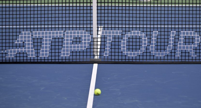 Aug 3, 2024; Montreal, Quebec, Canada; ATP Tour marking on the net at centre court during practice at IGA Stadium. Mandatory Credit: Eric Bolte-USA TODAY Sports