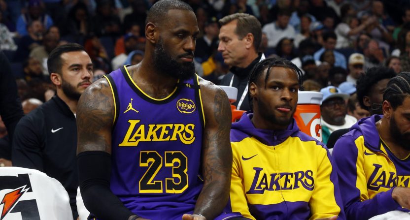 Nov 6, 2024; Memphis, Tennessee, USA; Los Angeles Lakers forward LeBron James (23) and Los Angeles Lakers guard Bronny James (9) sit on the bench during the first half against the Memphis Grizzlies at FedExForum. Mandatory Credit: Petre Thomas-Imagn Images