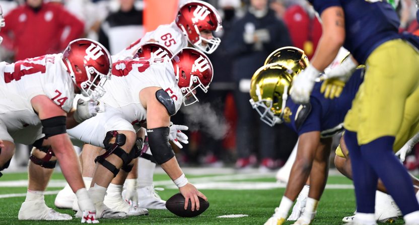 Dec 20, 2024; Notre Dame, Indiana, USA; Indiana Hoosiers offensive lineman Mike Katic (56) prepares to snap the ball during the first half against the Notre Dame Fighting Irish at Notre Dame Stadium. Mandatory Credit: Matt Cashore-Imagn Images