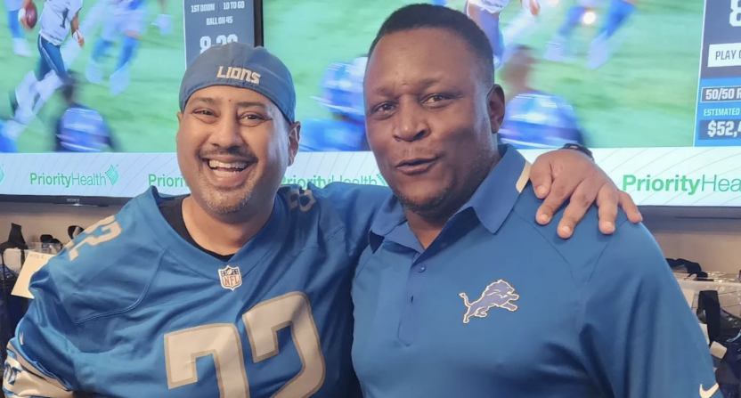 Detroit sports influencer Andy Isaac alongside Detroit Lions legend Barry Sanders