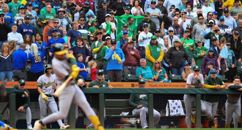 Oakland Athletics fans stand up during the final out of the ninth inning against the Seattle Mariners at T-Mobile Park.