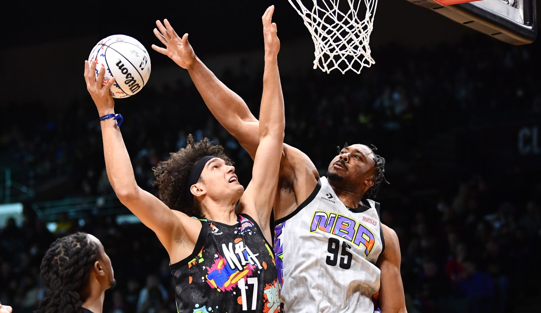 Feb 18, 2022; Cleveland, OH, USA; Team Walton player Anderson Varejao drives to the basket against Team Nique player Myles Garrett of the Cleveland Browns during the first half of the Ruffles NBA All-Star Celebrity Game at the Wolstein Center. Mandatory Credit: Ken Blaze-USA TODAY Sports