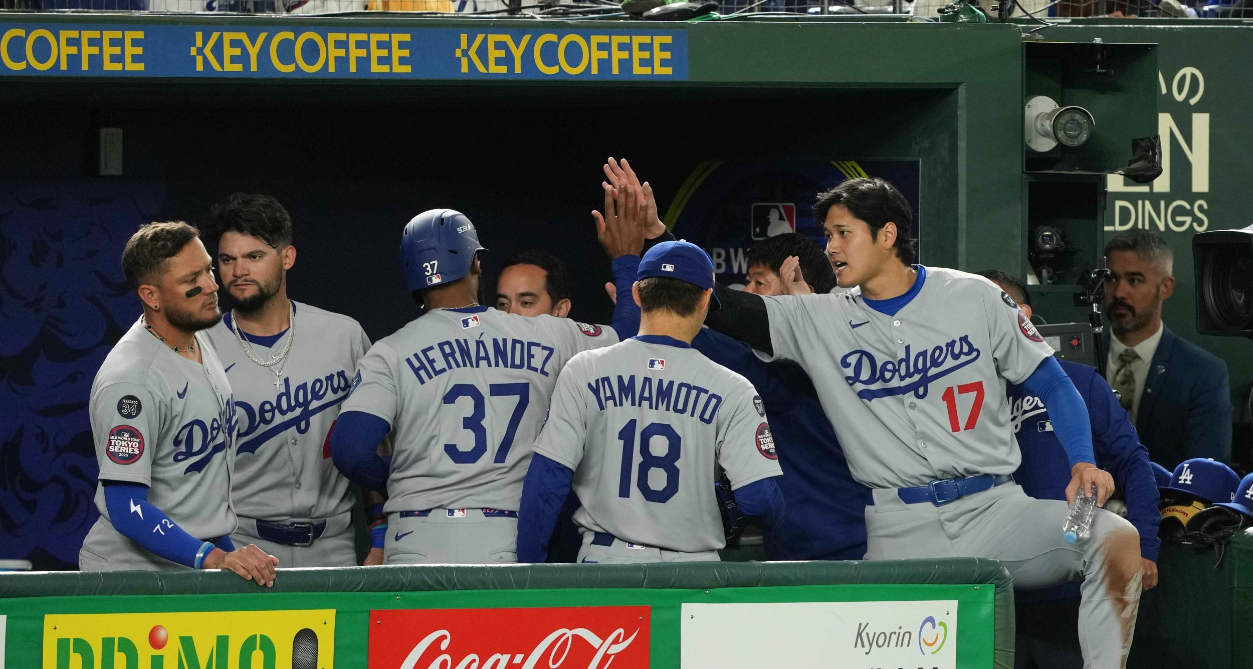 Mar 18, 2025; Bunkyo, Tokyo, JPN; Los Angeles Dodgers designated hitter Shohei Ohtani (17) celebrates with outfielder Teoscar Hernández (37) (left) after scoring a run in the fifth inning against the Chicago Cubs during the Tokyo Series at Tokyo Dome.