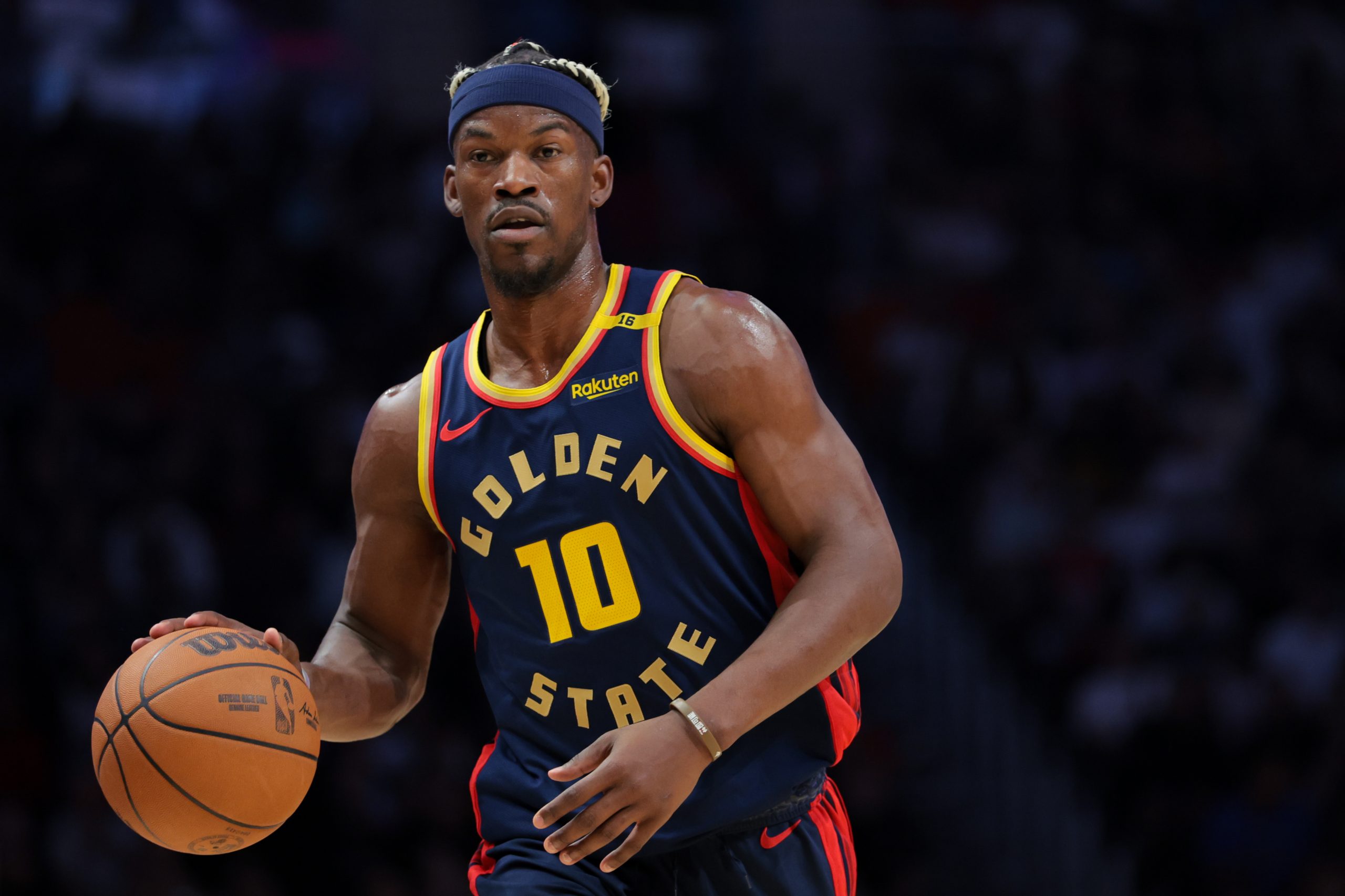 Mar 25, 2025; Miami, Florida, USA; Golden State Warriors forward Jimmy Butler III (10) dribbles the basketball against the Miami Heat during the first quarter at Kaseya Center. Mandatory Credit: Sam Navarro-Imagn Images