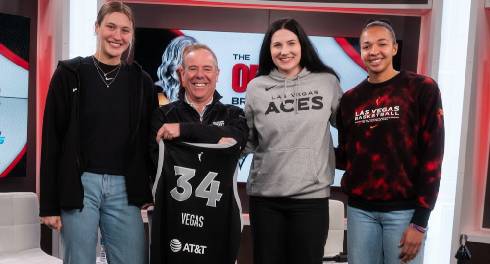 Las Vegas Aces players around the announcement of a deal with Scripps Sports.